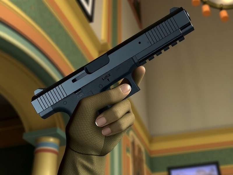 Tactical custom Glock 34 pistol with orange accents on a dark background